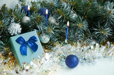 Christmas composition with Christmas tree branches in blue and silver balls.. Stock Photos
