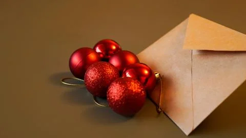 Christmas composition. Craft envelope and red balls Stock Photos