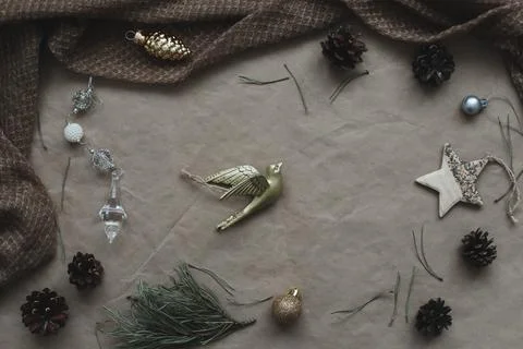 Christmas composition on craft paper background with gift box, fir branches Stock Photos