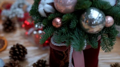 Christmas composition in dark gift box on light wooden surface table, close-up Video stock 89240436