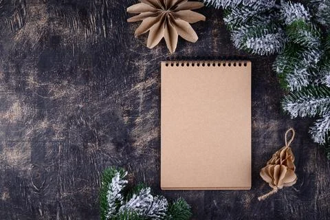 Christmas composition with empty craft notebook Stock Photos