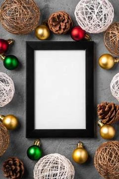 Christmas composition with empty picture frame. Colorful baubles Stock Photos
