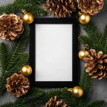 Christmas composition with empty picture frame. Golden ornament Stock Photos