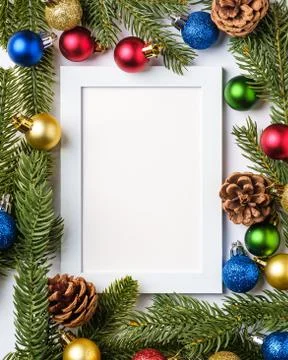Christmas composition with empty picture frame. Colorful ball ornaments Stock Photos