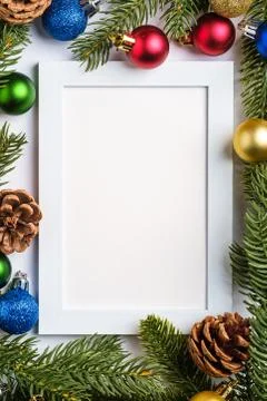 Christmas composition with empty picture frame. Colorful ball ornaments Stock Photos
