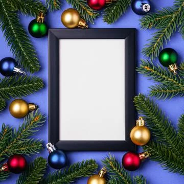 Christmas composition with empty picture frame. Colorful ornament Stock Photos