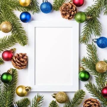 Christmas composition with empty picture frame. Colorful ball ornaments Stock Photos