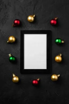 Christmas composition with empty picture frame. Colorful ornament decorations Stock Photos