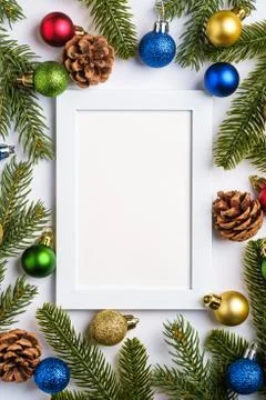Christmas composition with empty picture frame. Colorful ball ornament Stock Photos