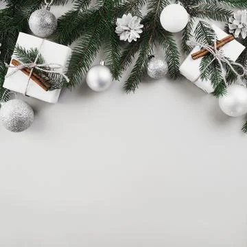Christmas composition fir tree branches with silver baubles. High quality photo Stock Photos