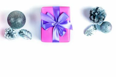Christmas composition flat lay Gift box satin ribbon bow cone nut on white ba Stock Photos