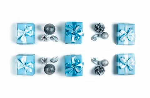 Christmas composition flat lay Gift box satin ribbon bow cone nut on white ba Stock Photos