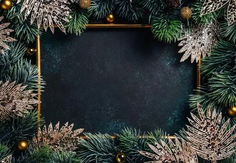 Christmas composition. Frame with pine branches and Christmas decorations on Stock Photos
