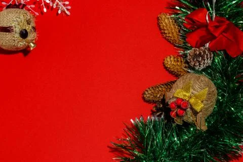 Christmas composition frame for text. Decorations on red background. Flat lay Stock Photos