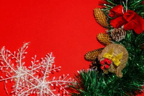 Christmas composition frame for text. Decorations on red background. Flat lay Stock Photos