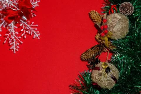 Christmas composition frame for text. Decorations on red background. Flat lay Stock Photos