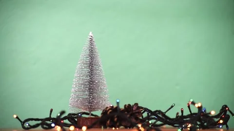 Christmas composition with garland and mini Christmas tree. New year decorations Stock Footage 256077425
