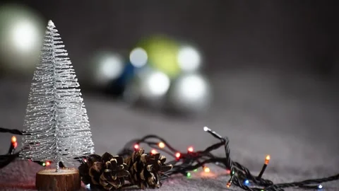 Christmas composition with garland and mini Christmas tree. New year decorations Stock Footage 256077438