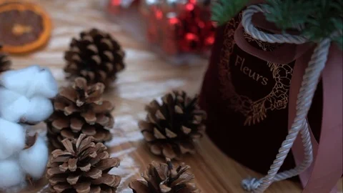 Christmas composition in gift box and handcrafted christmas decorations supply Video stock 89240491