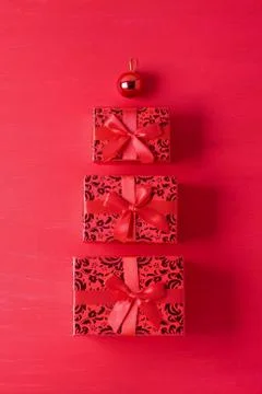 Christmas composition gift boxes ball red wooden background Stock Photos