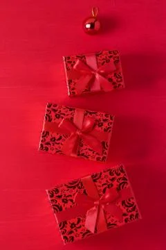 Christmas composition gift boxes ball red wooden background Stock Photos