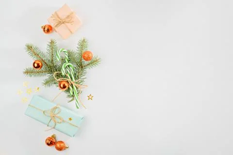 Christmas composition, gift boxes, spruce branches, Christmas balls toys on w Stock Photos
