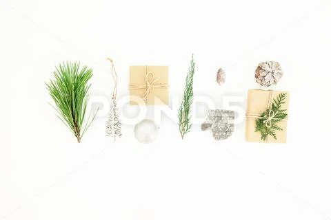 Christmas composition with gifts, decorations, branches and pine cone on whit Stock Photos