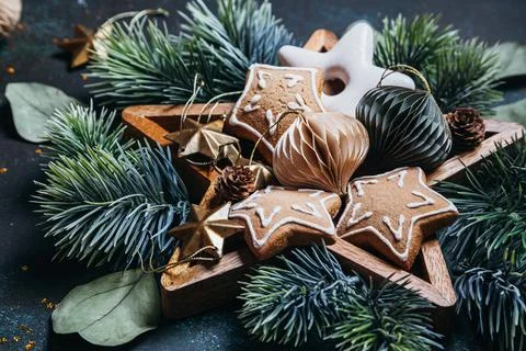 Christmas composition with gingerbread, pine branches, wooden and paper Chris Stock Photos