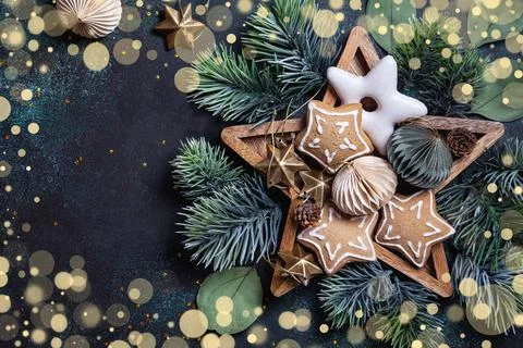 Christmas composition with gingerbread, pine branches, wooden and paper Chris Stock Photos