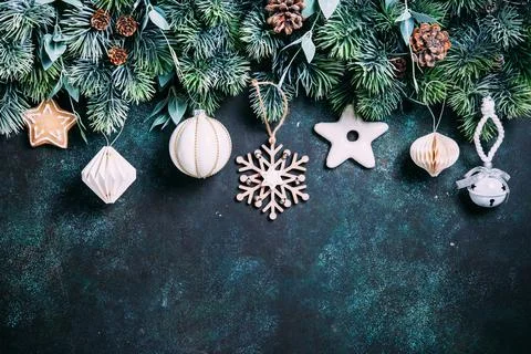 Christmas composition. Gingerbread, pine branches, white  decorations on gree Stock Photos