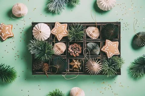Christmas composition. Gingerbread, pine branches, white and green decoration Stock Photos