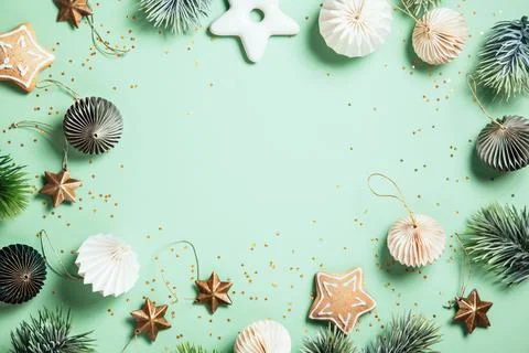 Christmas composition. Gingerbread, pine branches, white and green decoration Stock Photos