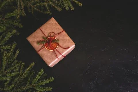 Christmas composition. Handmade gift box decorated with craft paper with Stock Photos