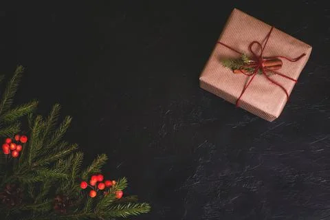 Christmas composition. Handmade gift box decorated with craft paper with brun Stock Photos