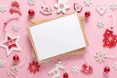 Christmas composition with a kraft envelope and red and white Christmas tree Stock Photos