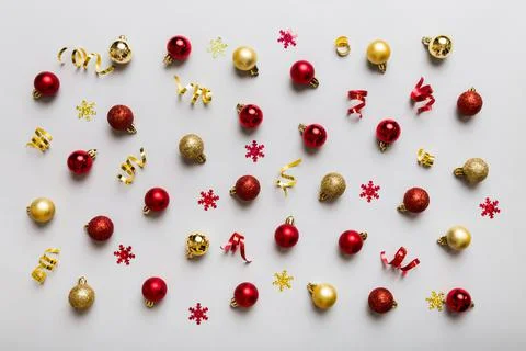 Christmas composition. a pattern of christmas balls on colored background. Fl Stock Photos