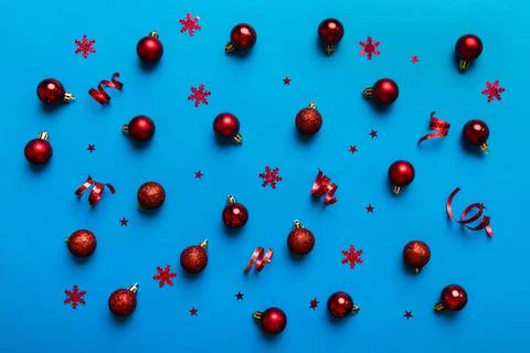 Christmas composition. a pattern of christmas balls on colored background. Fl Stock Photos