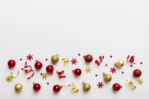 Christmas composition. a pattern of christmas balls on colored background. Fl Stock Photos