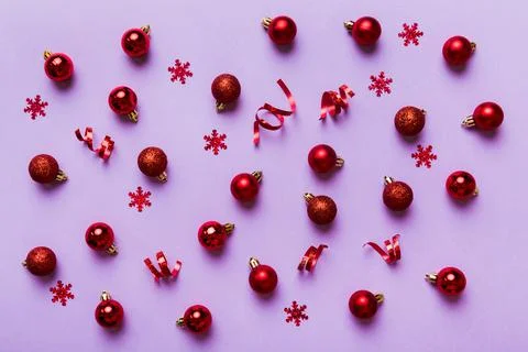 Christmas composition. a pattern of christmas balls on colored background. Fl Stock Photos