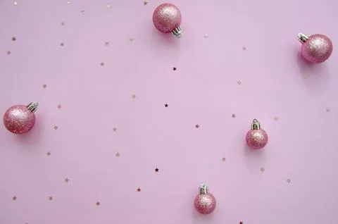 Christmas composition. A pattern of christmas balls and star glitter. Stock Photos