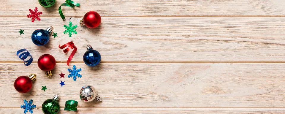 Christmas composition. a pattern of christmas balls on colored background. Fl Stock Photos