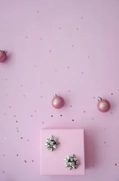 Christmas composition. A pattern of christmas pink balls, gift box. Stock Photos