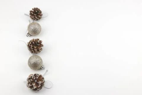 Christmas composition of pine cones and Christmas decorative balls on a white Stock Photos