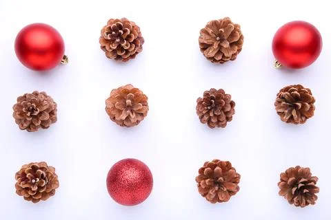 Christmas composition with pine cones and red christmas balls on white backgr Stock Photos