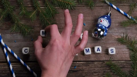 Christmas composition with pine needles and lettering cubes with congratulation Stock Footage 167173702