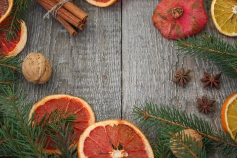 Christmas composition. Spruce branches, candy cane, warming tea Stock Photos