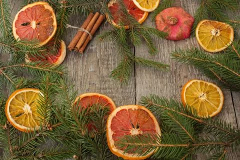 Christmas composition. Spruce branches, candy cane, warming tea Stock Photos