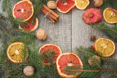 Christmas composition. Spruce branches, candy cane, warming tea Stock Photos