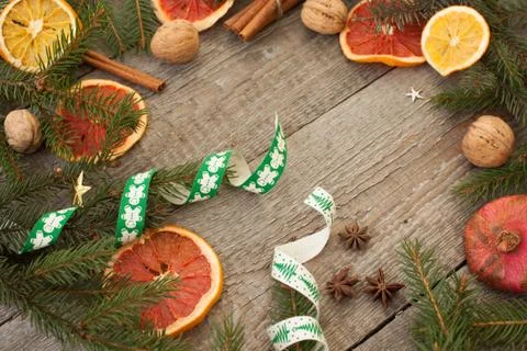 Christmas composition. Spruce branches, candy cane, warming tea Stock Photos
