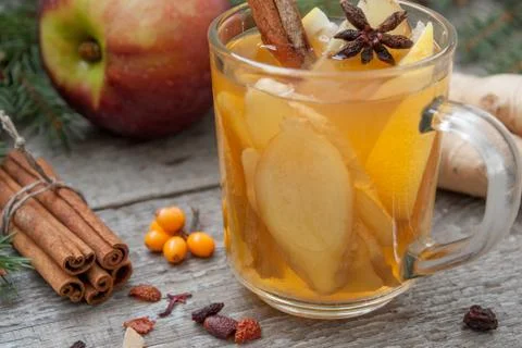 Christmas composition. Spruce branches, candy cane, warming tea Stock Photos
